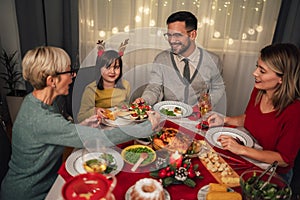 Multi-generation family enjoying in a lunch together at home. Family on Christmas dinner at home