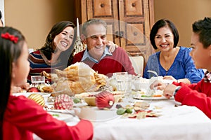 Multi Generation Family having Christmas Meal