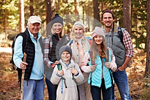Multi generation family on hike in forest, group portrait