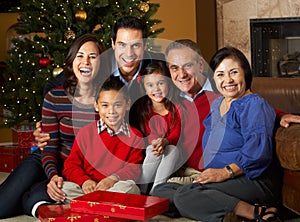 Multi Generation Family Opening Christmas Presents