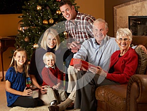 Multi Generation Family Opening Christmas Presents