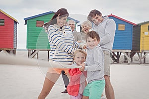 Multi-generation family playing tug of war