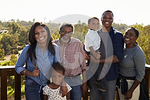 Multi Generation Family Standing On Outdoor Observation Deck