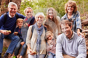 Multi-generation family with teens eating outdoors together