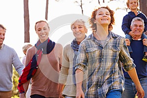 Multi-generation family walking in countryside, close up photo