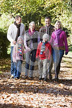 Multi-generation family walking through woods