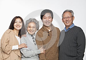 Multi generation happy family portrait, studio shot