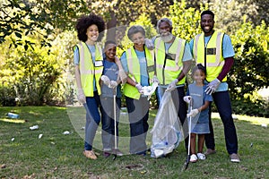 Multi-generation mixed race family collecting garbage