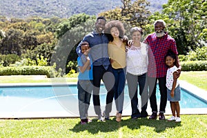 Multi-generation mixed race family enjoying their time at a garden