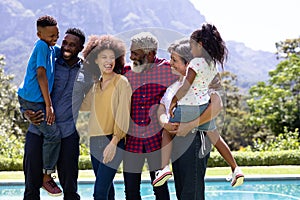 Multi-generation mixed race family enjoying their time at a garden