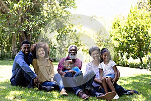 Multi-generation mixed race family enjoying their time at a garden