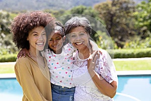 Multi-generation mixed race family enjoying their time at a garden