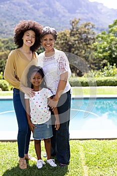 Multi-generation mixed race family enjoying their time at a garden