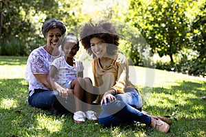 Multi-generation mixed race family enjoying their time at a garden