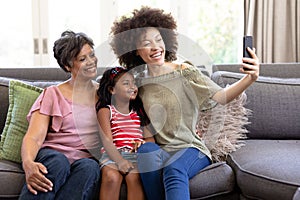 Multi-generation mixed-race family enjoying their time at home