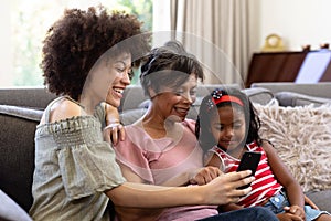 Multi-generation mixed-race family enjoying their time at home