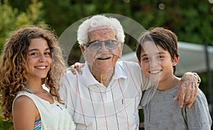 Multi-generational family great-grandfather and great-grandchildren