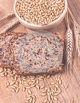 Multi-grain bread on a wooden background. Healthy food concept.