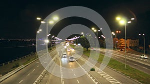 Multi-lane road in Kyiv at night. Illuminated street of evening city