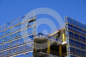 Scaffolding and Blue Safety Cladding on Construction