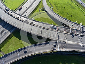 Multi-level interchanges of city ringroad with driving vehicles. Aerial view. St. Petersburg, Russia photo