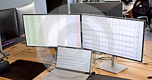 A multi-monitor setup enhances business productivity at the office