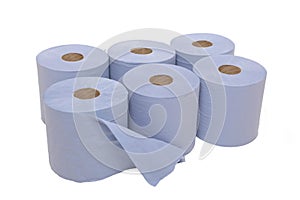 Multi pack of industrial sized blue paper towels with one roll open