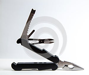 Multi purpose tool on white background  ,camping and survival tools for emergency use