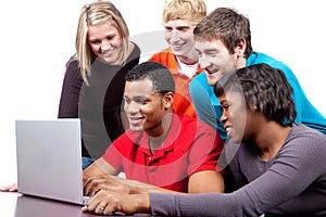 Multi-racial college students by a computer