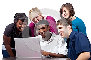 Multi-racial college students sitting a a computer