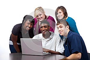 Multi-racial college students sitting by computer