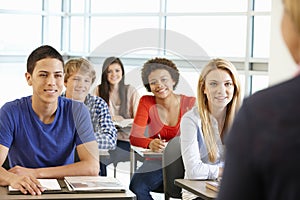 Multi racial teenage pupils in class