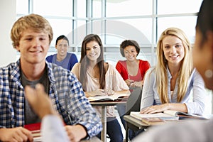 Multi racial teenage pupils in class photo