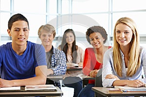 Multi racial teenage pupils in class