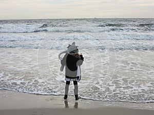 Multi Racial tween girl on beach by ocean