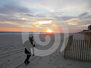 Multi Racial tween girl on beach by ocean