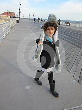 Multi Racial tween girl on boardwalk on beach