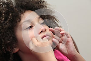 Multi Racial tween girl close up on face