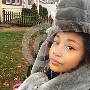 Multi Racial tween girl with elephant hat