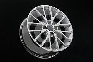 Multi-spoke gray alloy wheel on black background