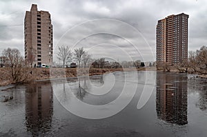 Multi-storey buildings reflecting in the river