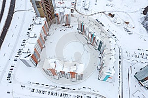 Multi-storey high-rise apartment buildings in new residential area. aerial view in winter