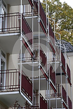 Multi-storey house with windows and balconies
