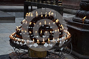 A multi-tier candlestick with candles