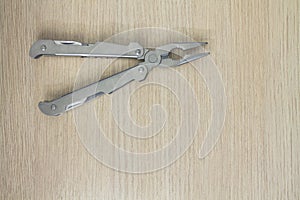 Multi tool on wooden background 3