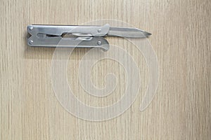 Multi tool on wooden background 4