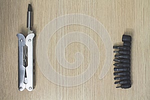 Multi tool on wooden background 7