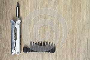 Multi tool on wooden background 8