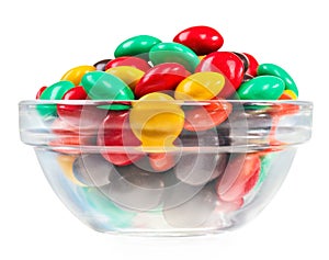 Multicolor bonbon sweets in glass bowl, isolated photo