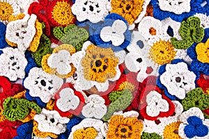 Multicolor crocheted flowers background